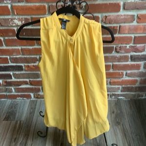 Yellow sleeveless blouse.